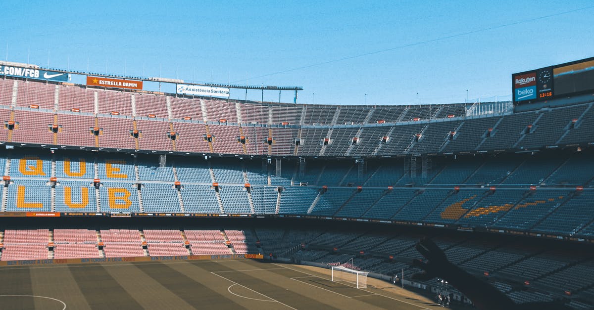 Schengen visa for Spain - Blue and Red Stadium Under Blue Sky