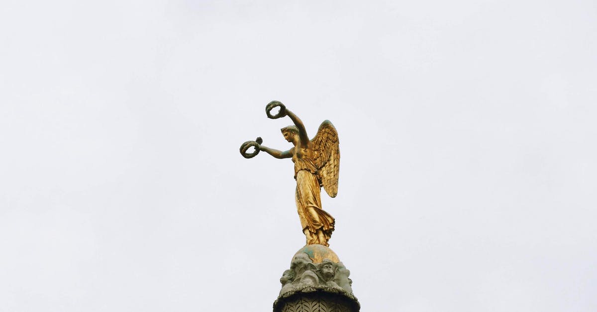 Schengen visa issued by France to Sweden - Gold Angel Statue Under White Sky