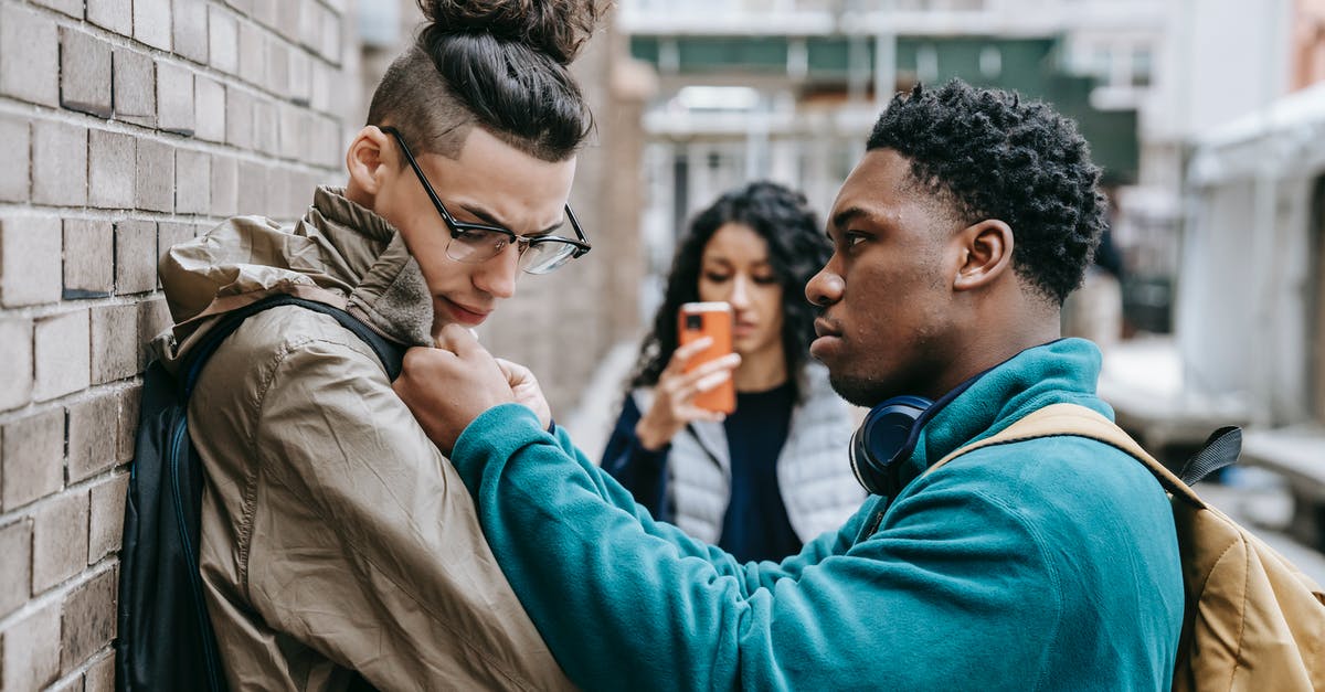 Schengen Visa Photo requirement - conflict - Multiracial students having argument on city street