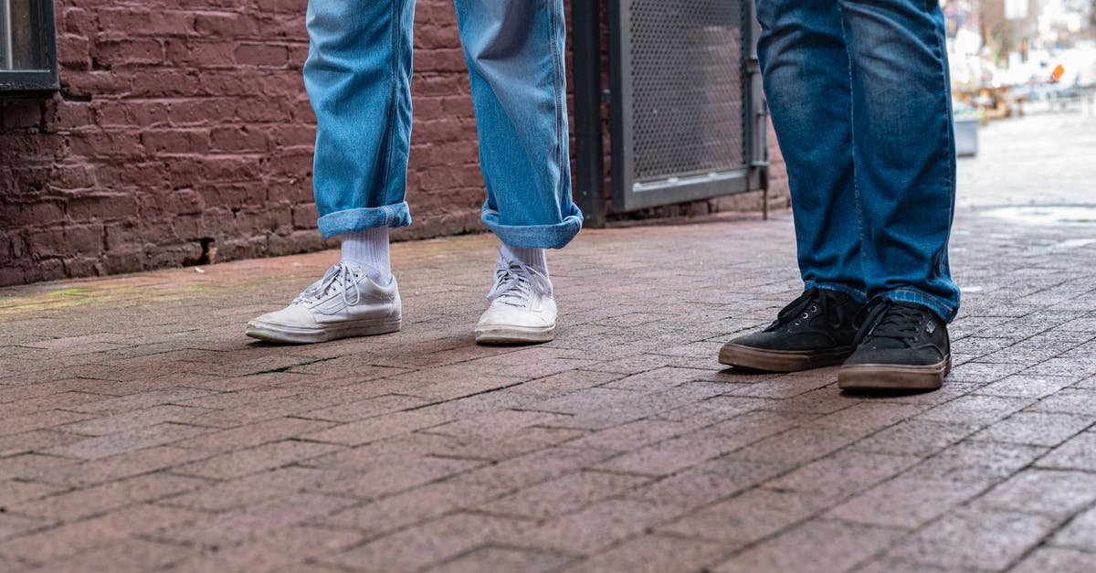 Schengen Visa question (multiple legs involving non-schengen countries) - Person in Blue Denim Jeans and White Sneakers Standing on Brown Brick Floor