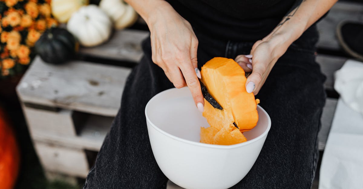 Screwdrivers, scalpel and knife in checked baggage - Person Holding Sliced Orange Fruit in White Ceramic Bowl