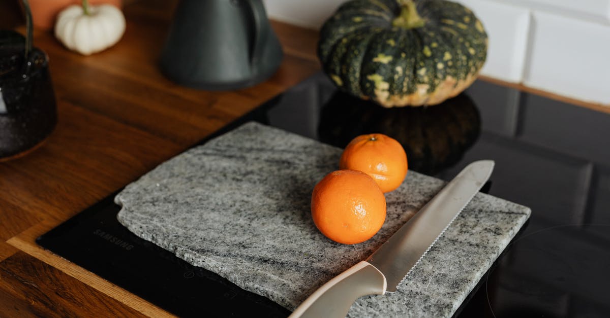 Screwdrivers, scalpel and knife in checked baggage - Orange Fruit on Black Table Mat