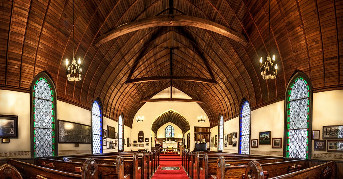 Seat aisles blocked by baggage - Brown and White Cathedral Building