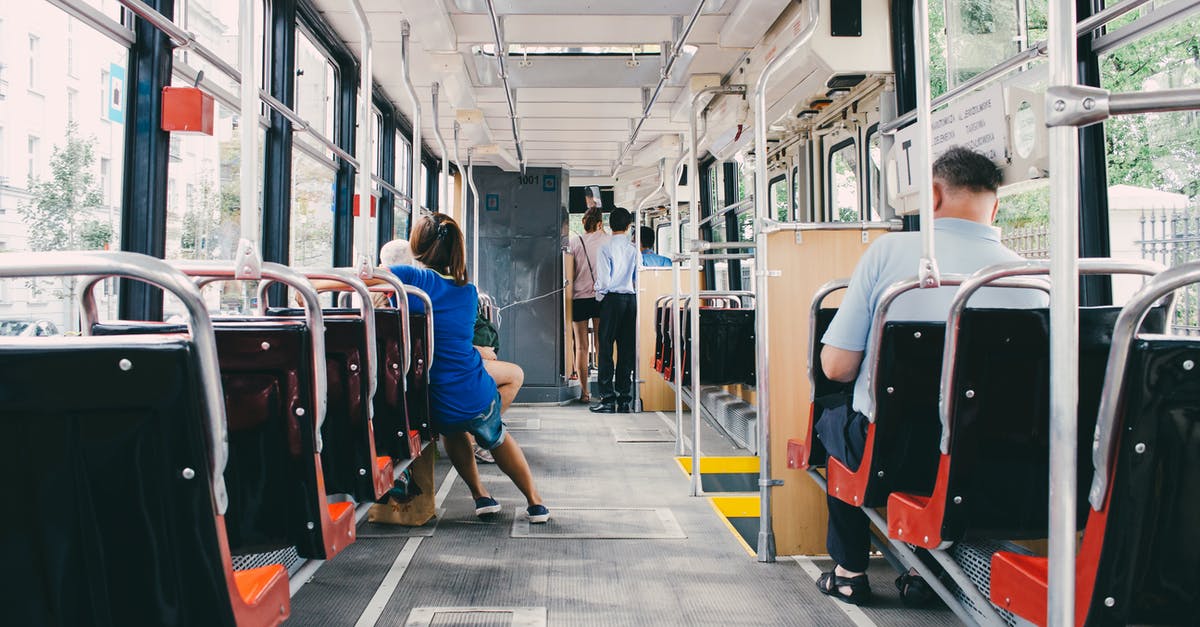 Seat booking fee on Lufthansa / Swiss air - Unrecognizable passengers in modern bus during trip