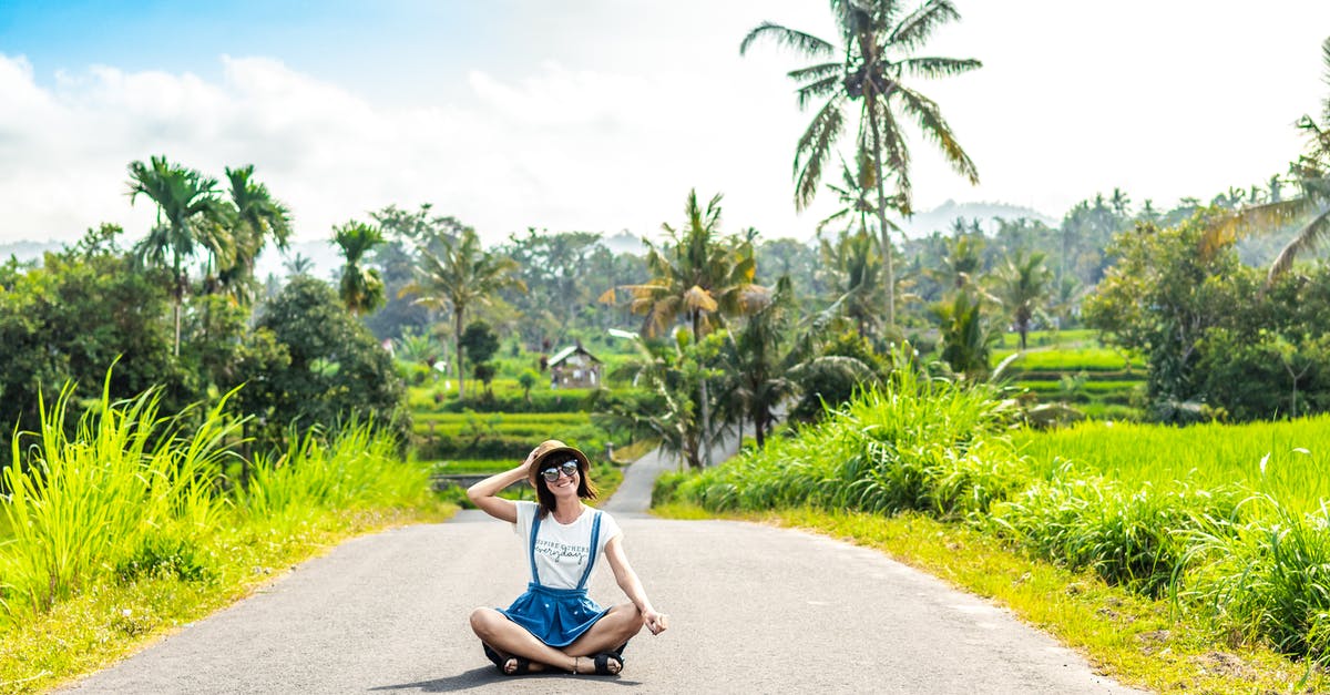 Second 60 days tourist visa Indonesia - Woman Sitting on Road