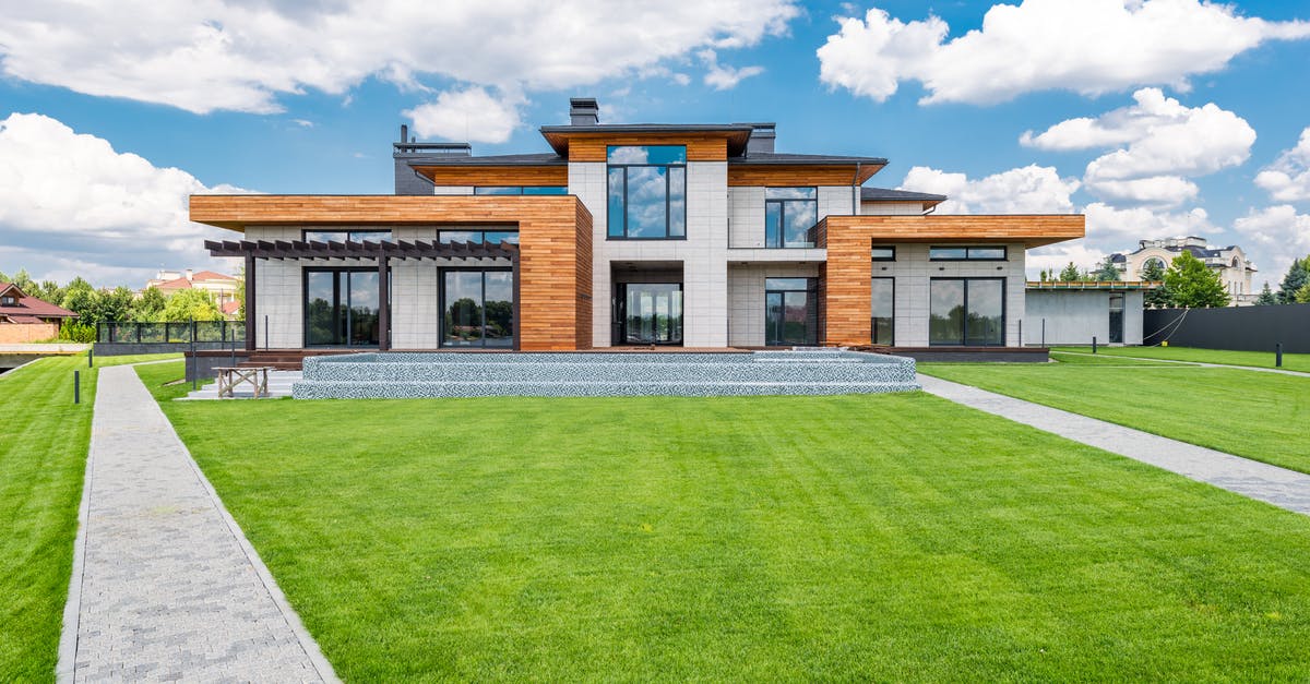 Second entrance to Schengen area on a multiple entrance visa - Exterior of modern house with glass doors and panoramic windows