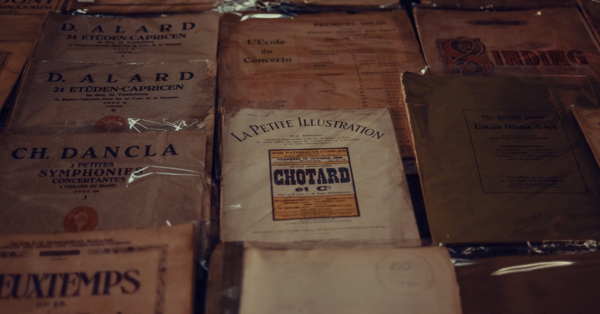 Secondhand book market or area in Beijing? - From above of various vintage music notation books placed on table in shop