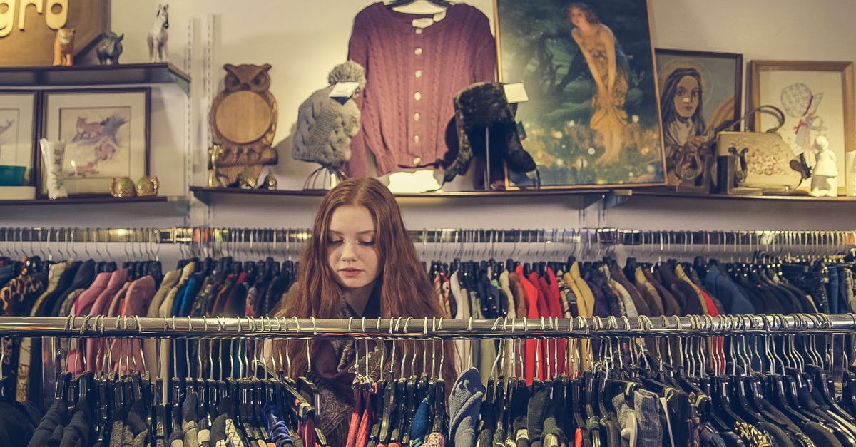 Secondhand book market or area in Beijing? - Photo of Woman Near Clothes