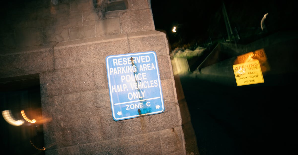 Secure long-term parking in Johannesburg - Signboard restricting parking for cars on reserved area for police vehicles at night