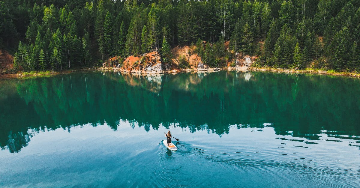 Seeking lake to paddle board at Mt Baker, Glacier, WA - A Woman Doing Paddle Boarding on the Lake 