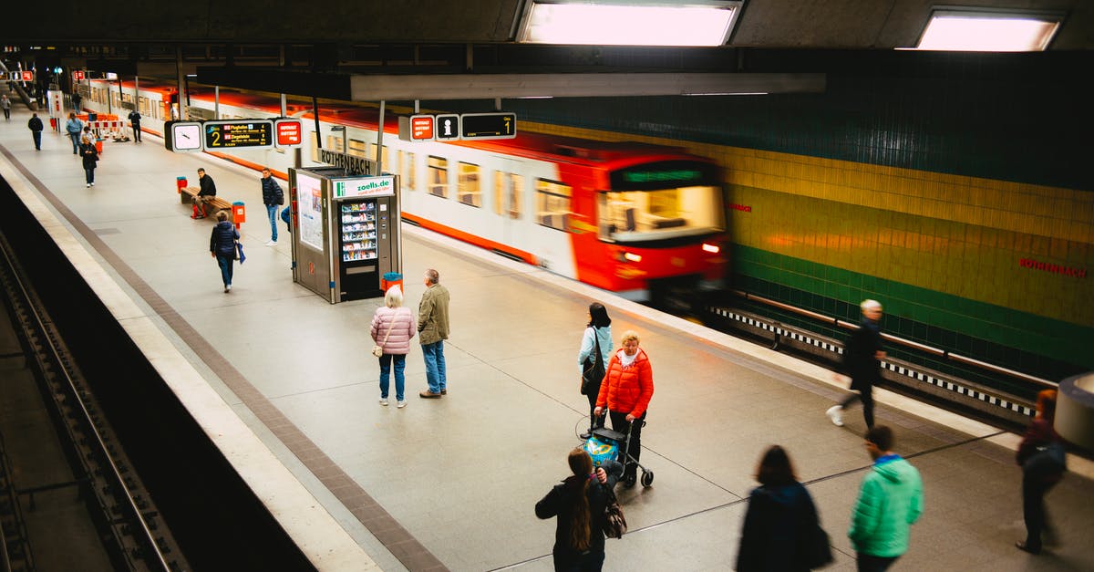 Seeking Starbucks in Vienna very near to public transportation - People Walking on Train Station