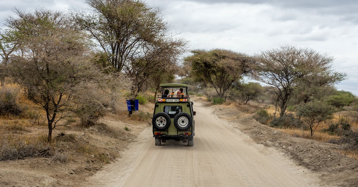 Self-drive vs. guided safari in Southern Africa - A Safari Jeep on Dirt Road