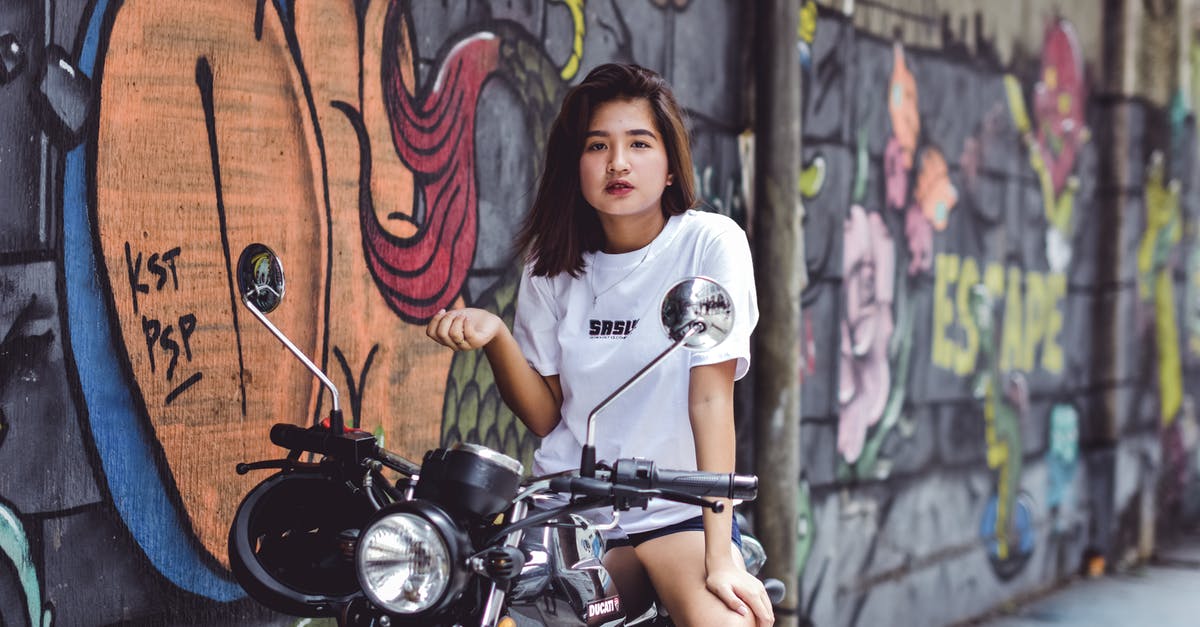 Selling an imported second hand motorcycle in Pakistan - Photo of Woman Sitting on Motorcycle