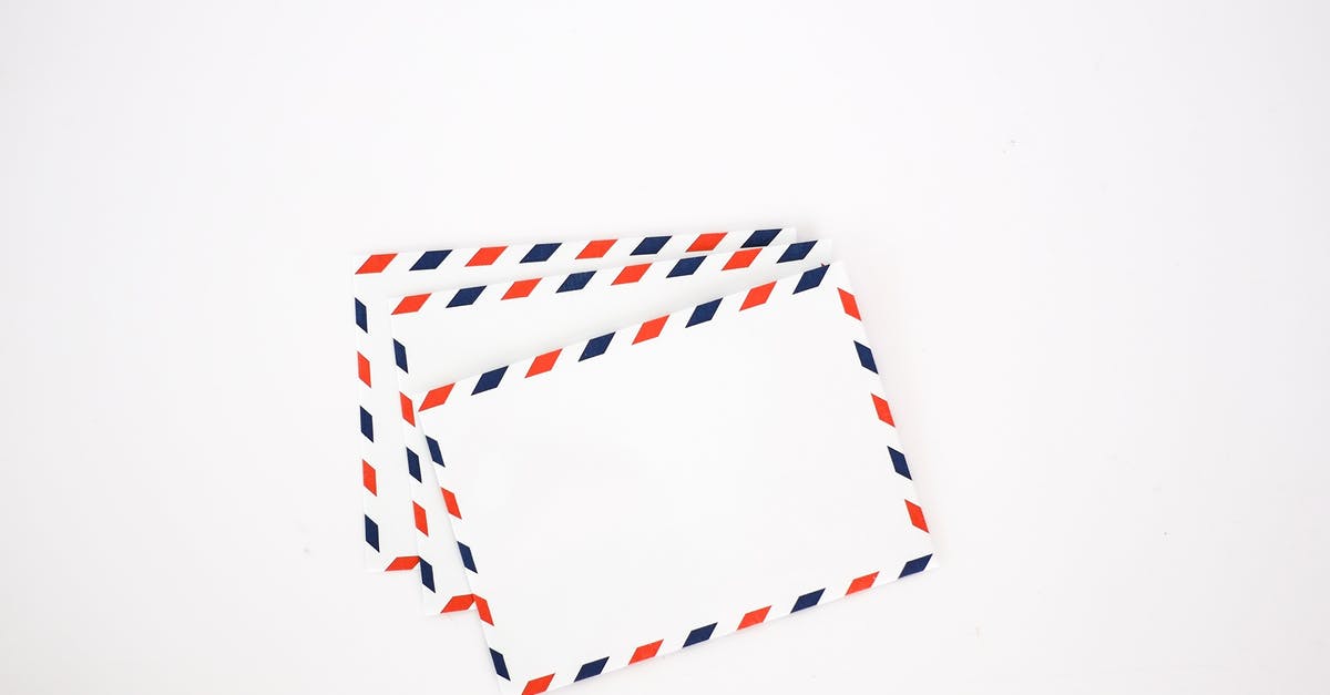 Sending a letter to Manila/Philippines to be picked up at the post office (Poste Restante) - Top view set of white envelops with striped red and blue edges placed on plain white background
