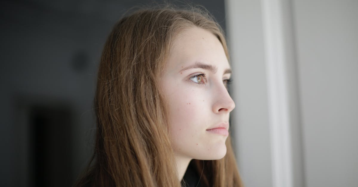 Sending gifts home during long trips - Pensive young woman in living room