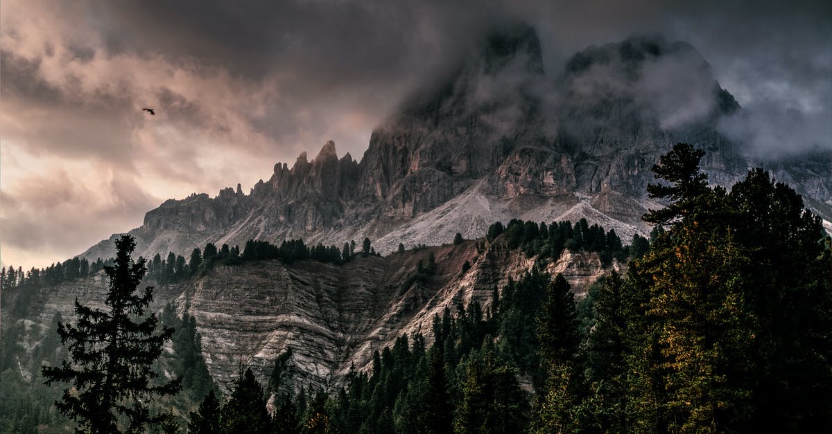 September in Dolomites - Photo of Mountain With Ice Covered With Black and Gray Cloud