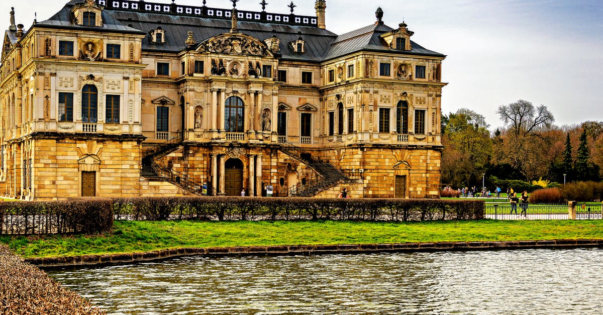 Settled Syrian in Germany to visit UK - Brown Concrete Mansion Under Sunny Sky