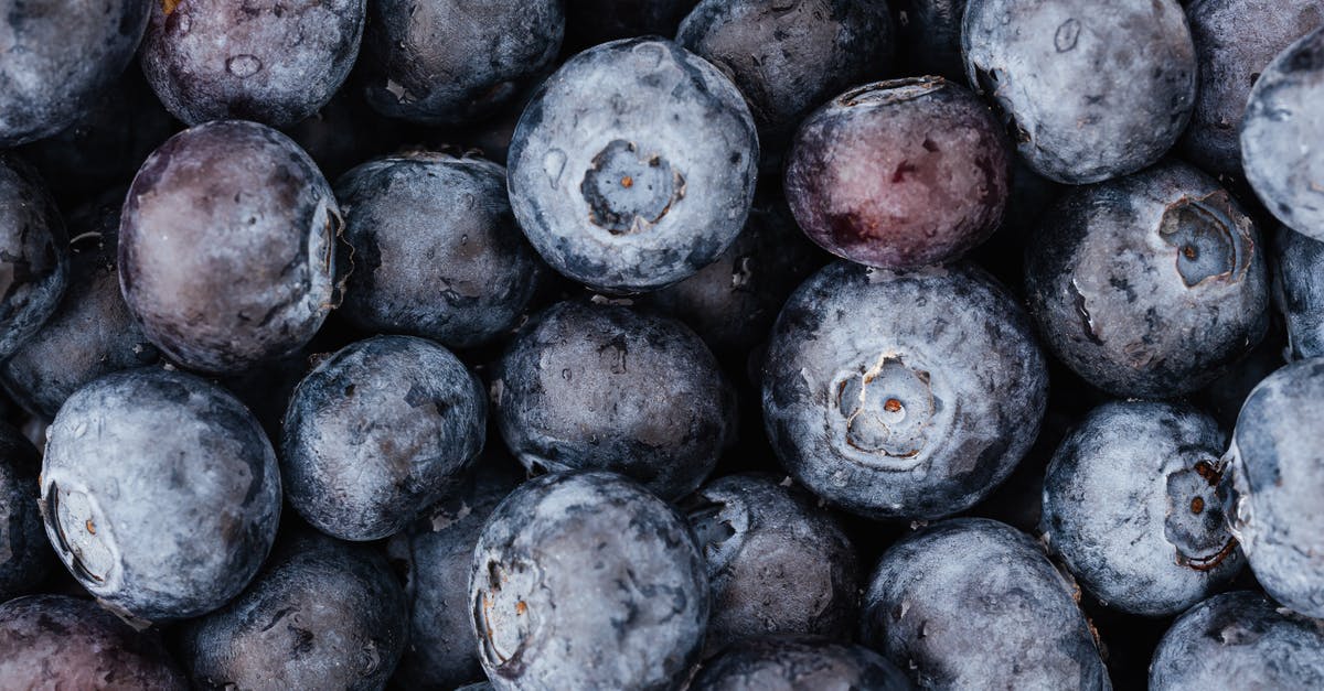 Several questions about my overstayed visa [closed] - Top view closeup of colorful ripe blueberries arranged in full frame heap