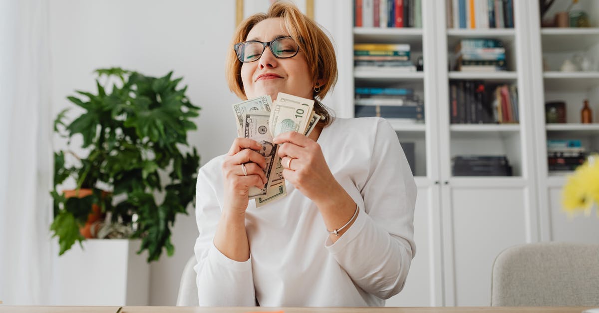 (SHA?) hashes on receipts [closed] - Woman Holding Dollar Bills Smiling