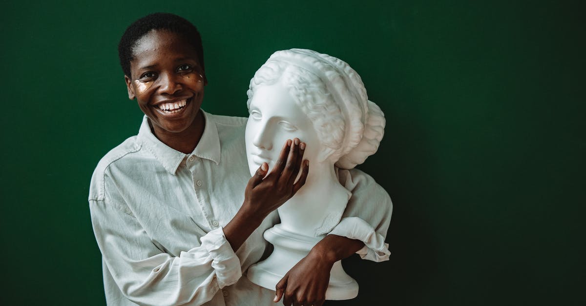 Short connections in Lomé - Man in White Dress Shirt Holding White Textile