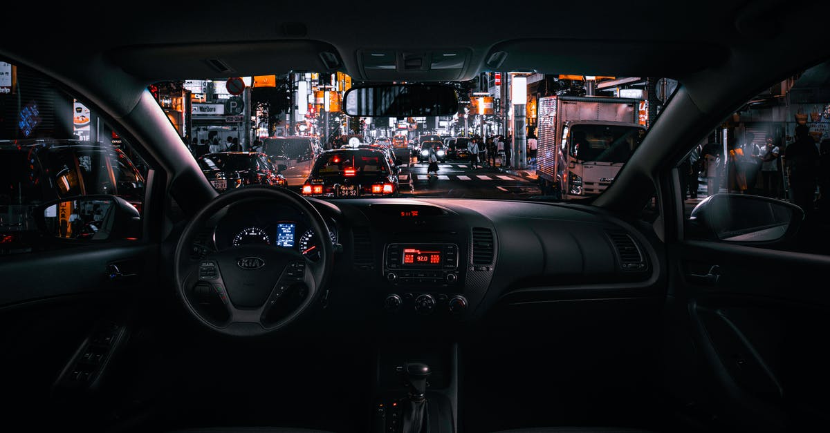 Short term car rentals in Japan - Black Car Steering Wheel and Interior during Night Time