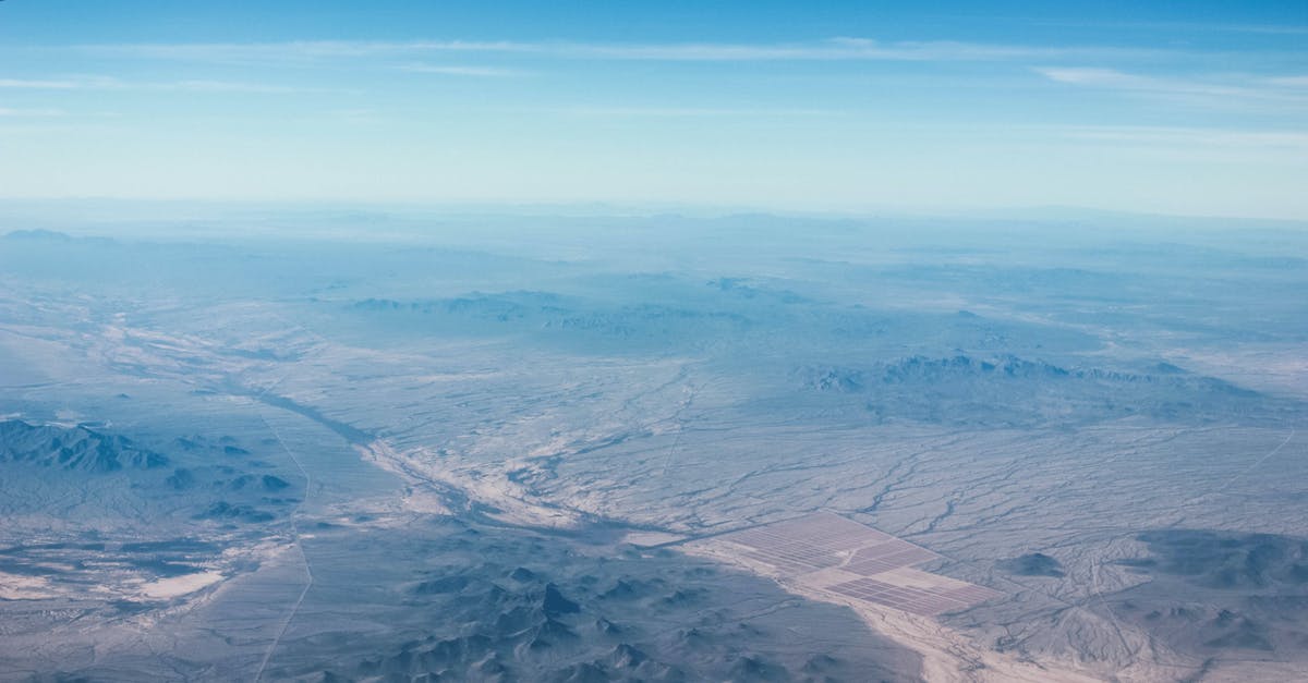 Shortest transatlantic flight from Europe to somewhere, so that continental US can be reached by land (with possible ferry) - Aerial Photography of Mountains and River Shortest transatlantic flight from Europe to somewhere, so that continental US can be reached by land (with possible ferry) - Aerial Photography of Mountains and River
