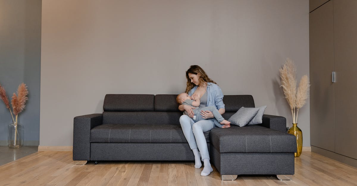 short-term childcare in June/July in Europe - Woman in White Shirt Sitting on Gray Couch