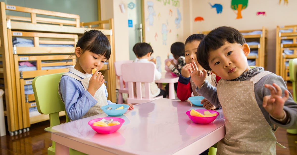 short-term childcare in June/July in Europe - Three Toddler Eating on White Table