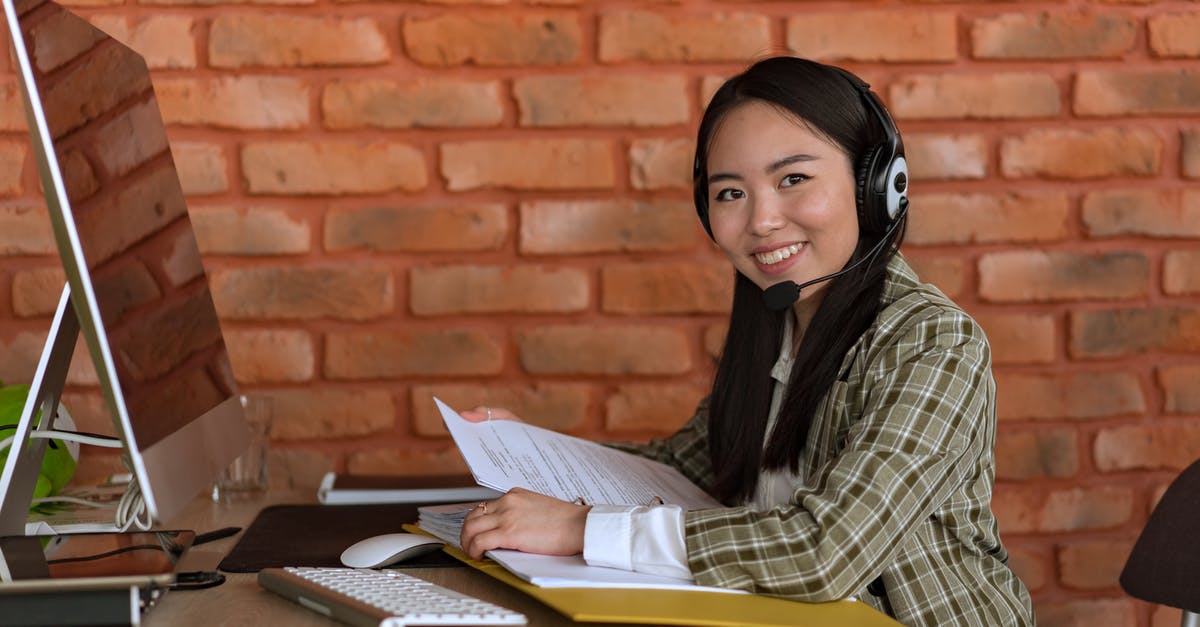 Shoul supporting documents for a Schengen visa be translated? - Smiling Woman with Headset Holding Files at Work