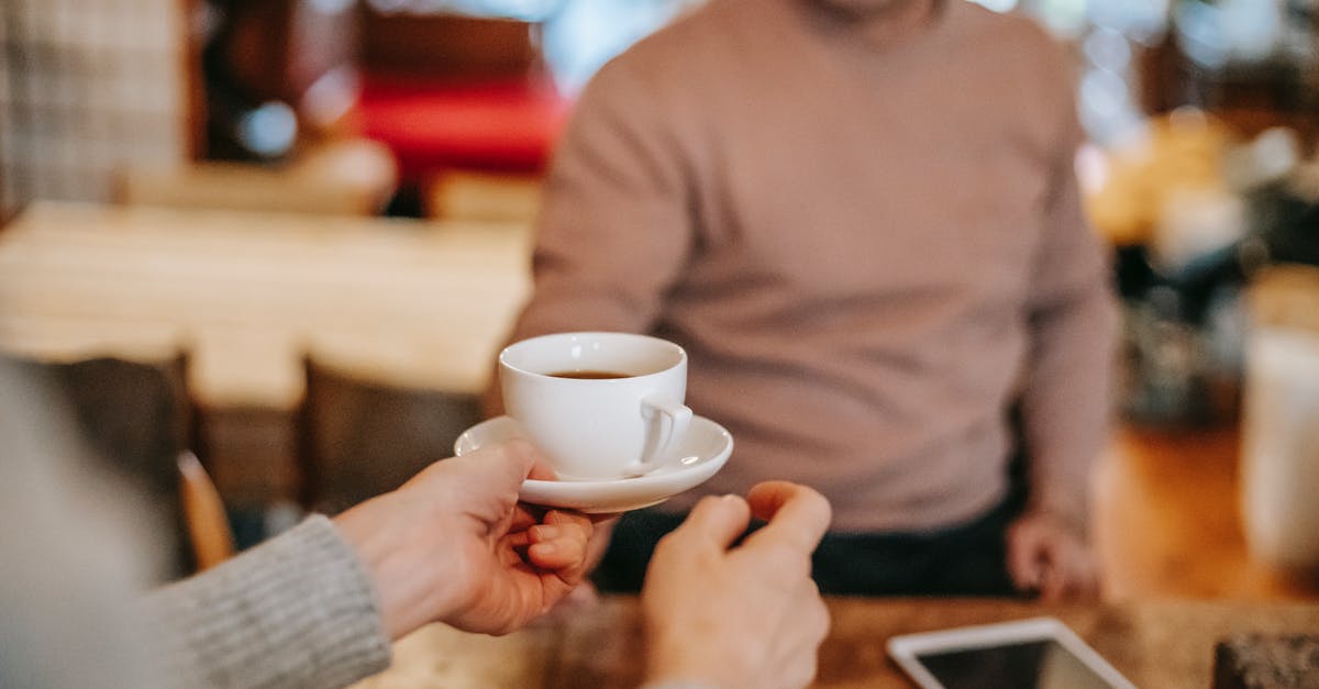 Should I take my own coffee to Japan? - Crop couple having breakfast together with coffee at home