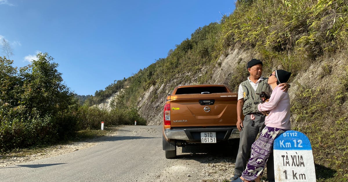 Shower at a truck stop for a couple travelling in car - Old Asian couple traveling together on truck Shower at a truck stop for a couple travelling in car - Old Asian couple traveling together on truck
