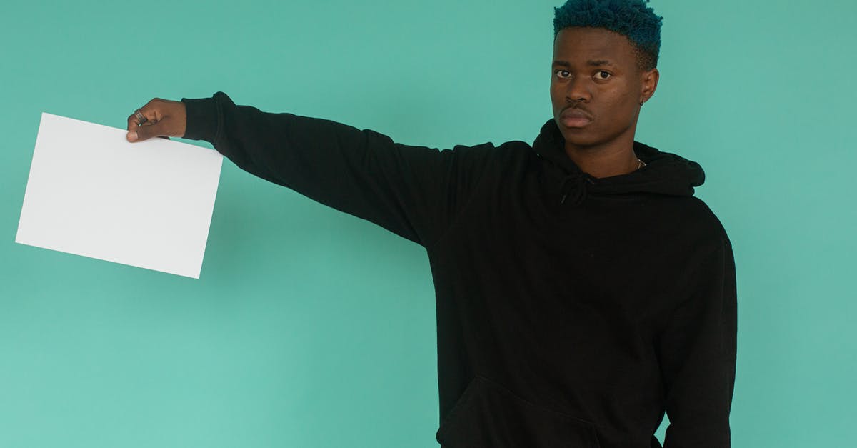 Showing evidence for informal savings - Young black man demonstrating empty paper