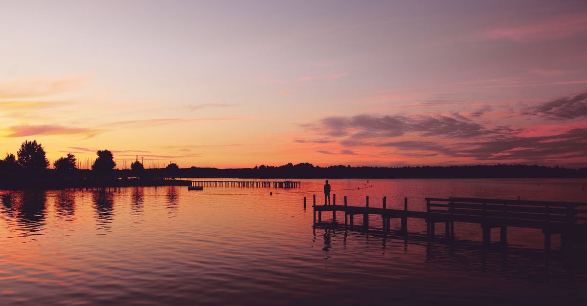 Sightseeing during 12-hour stop-over at Incheon - Silhouette Photography of Man Standing on Dock