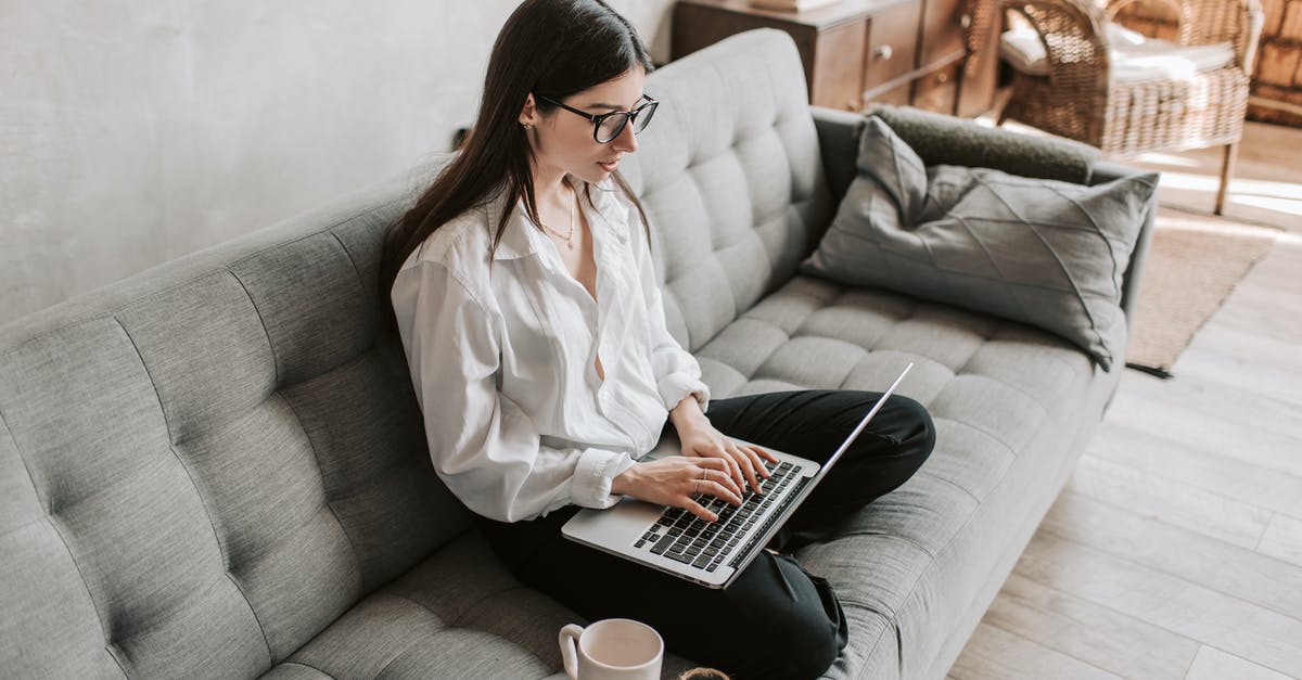 Signing digital Family information form for Canadian Visa - Woman Working At Home Using Laptop