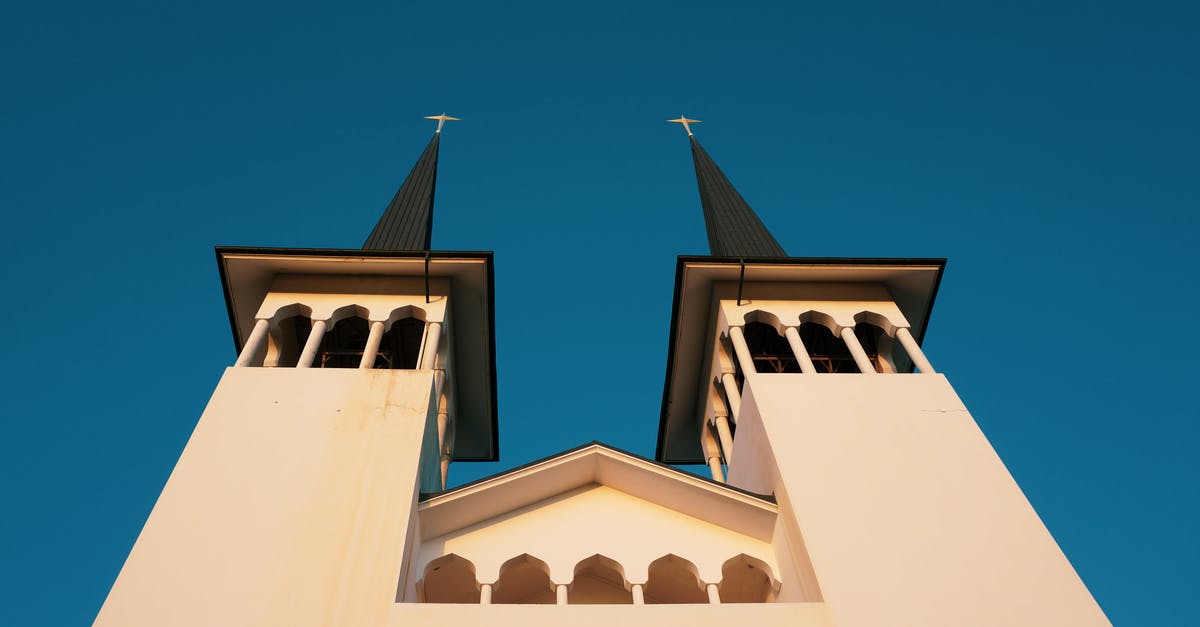 Simple Questions about Travel History [closed] - Old cathedral with arched details and towers on sunny day