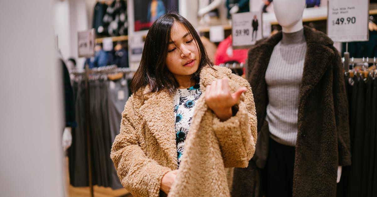 Simpler stop-over option - Woman Checking Price Near Mannequin