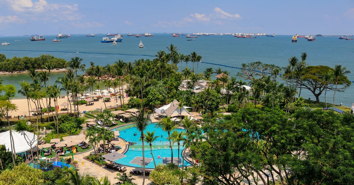 Singapore downtown and Sentosa island - South China Sea from Rasa Sentosa Resort shoreline