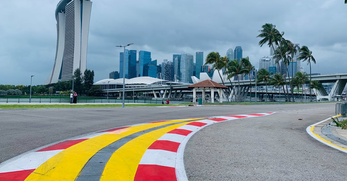 Singapore to Sydney to Canberra: where do we clear customs - Asphalt road on racetrack in modern city district
