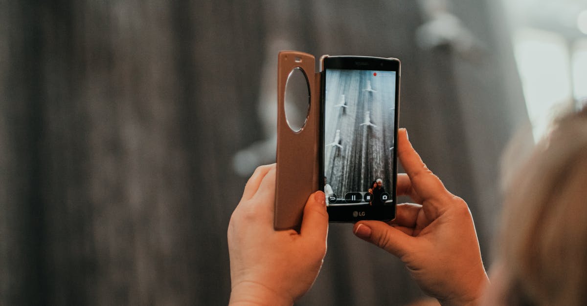 Singapore Visa application by mail, included only one photo [closed] - Person Holding Iphone With Brown Case