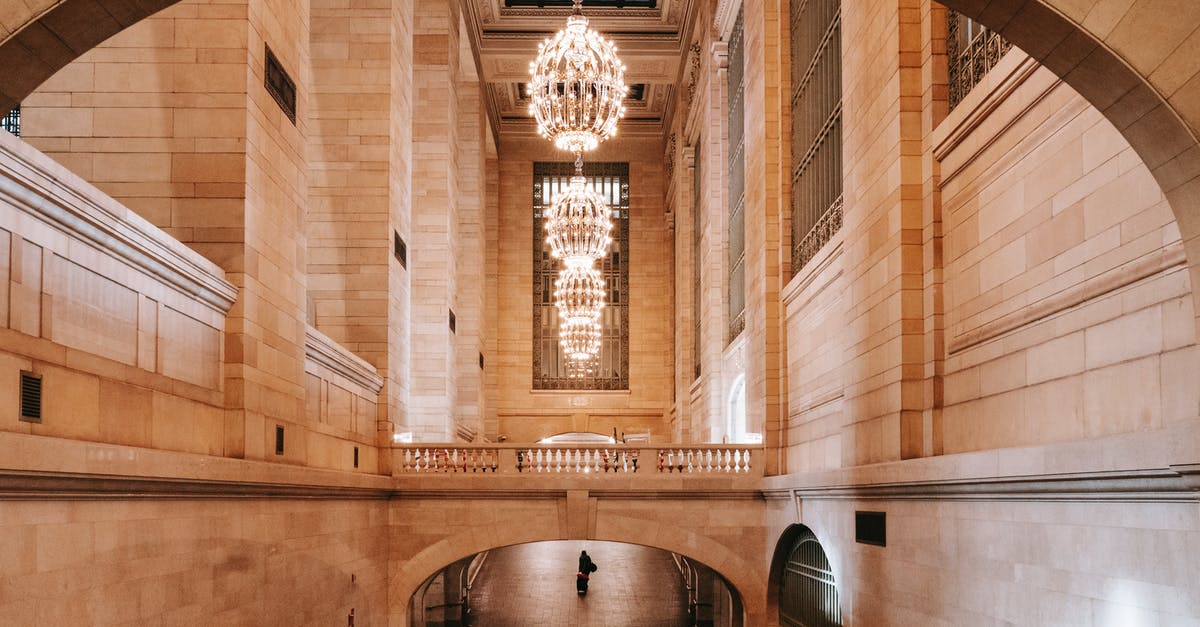 Skiplagged - Beijing to USA destination - Interior of arched passage in railway terminal with chandeliers