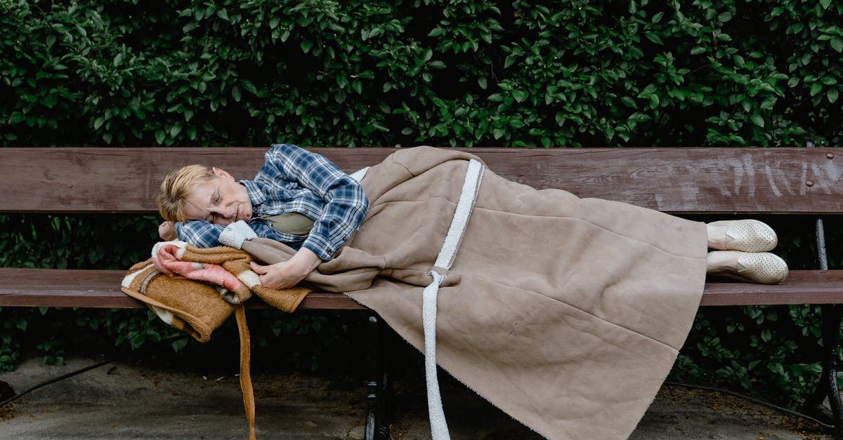 Sleeping bag while hostelling around Europe in summer? - Woman Sleeping on a Wooden Bench