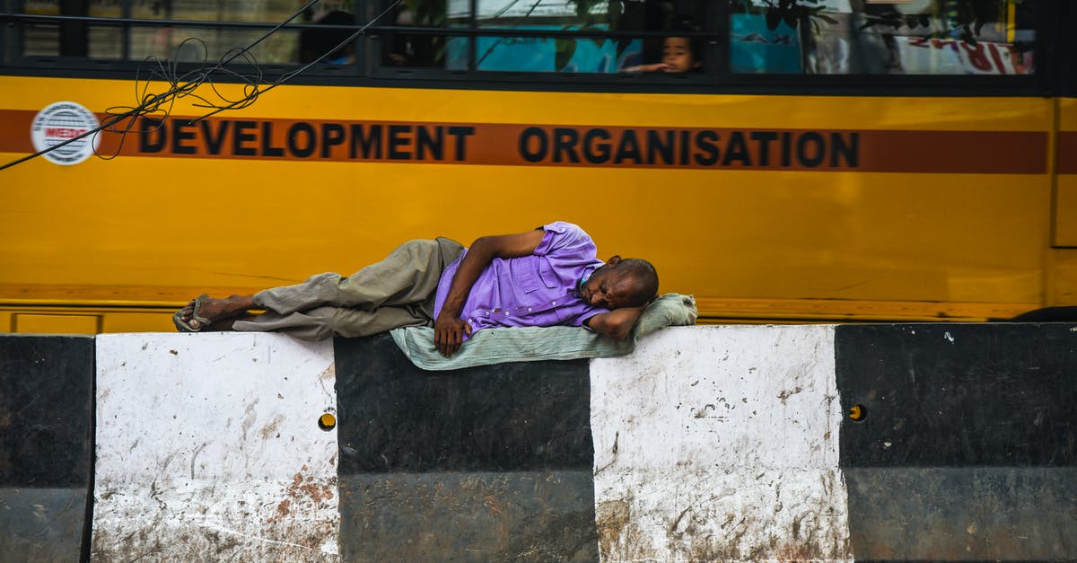 Sleeping bus laws in Europe? [closed] - Man Lying On Barricades