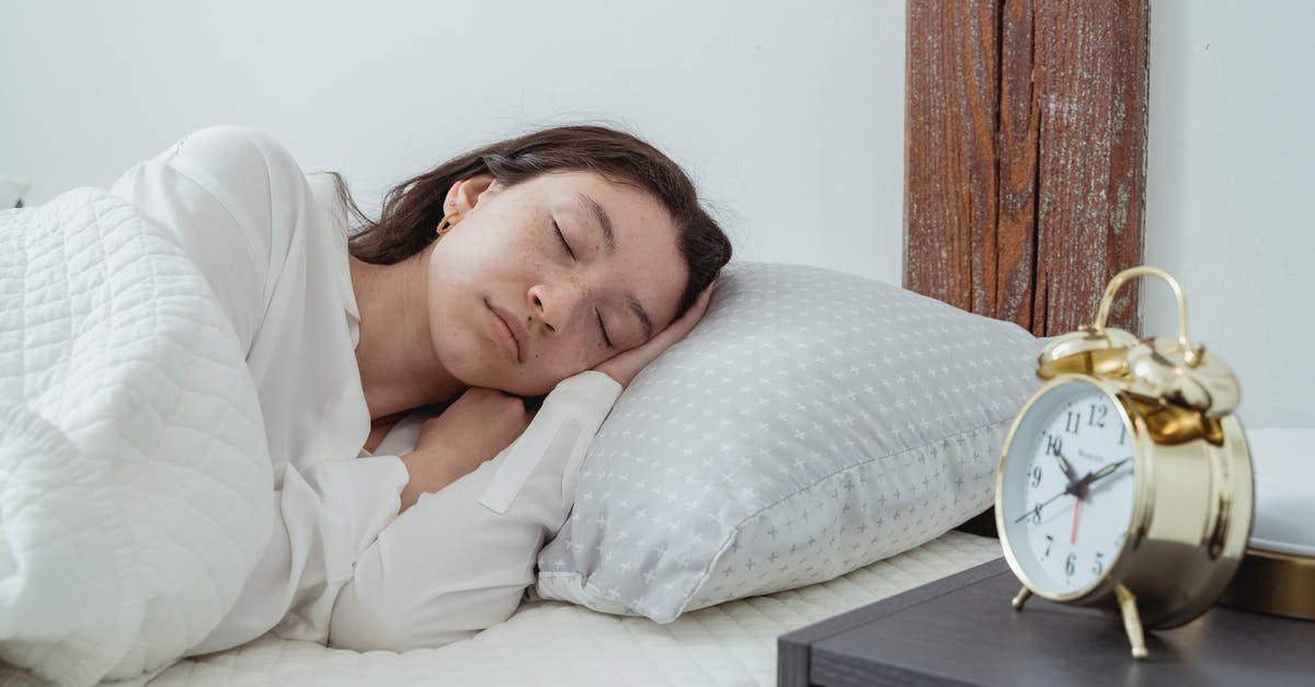 Sleeping/Narcotic Gas Alarm [closed] - Calm woman sleeping on pillow in bedroom