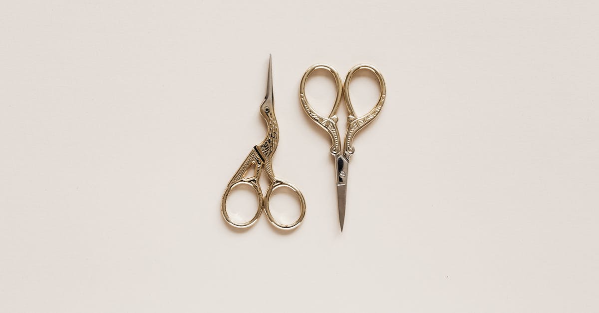 Small suitcase with top-loading? Does it exist? - Top view composition of scissors of various shape with carved ornament on beige table