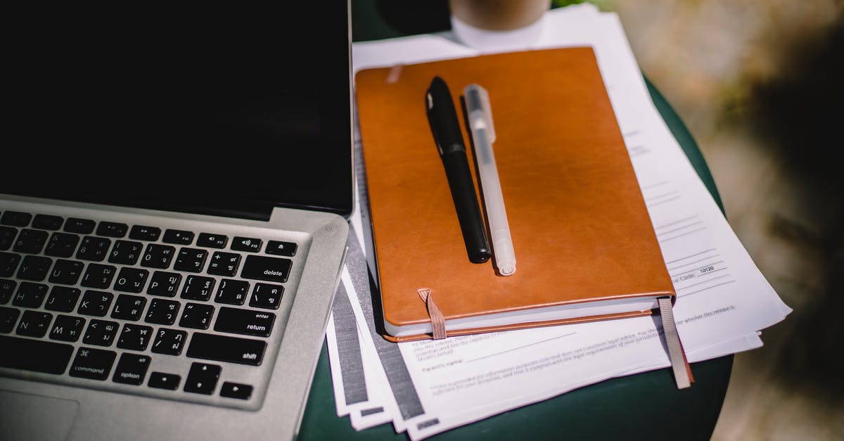 Software, Apps, Online Planner for planning backup route - Planner and pens on table with laptop