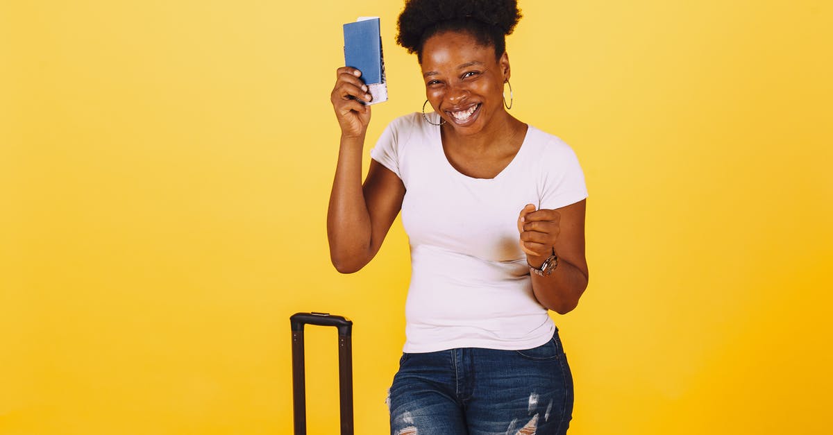 South African passport holder traveling via Heathow to Ireland [duplicate] - Smiling Woman in White Shirt Holding Her Passport