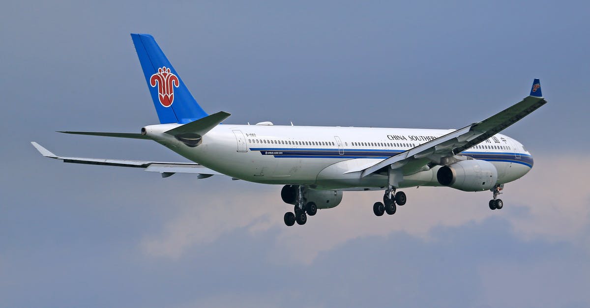 Spirit Flight between ORD and OAK - White and Blue Air Plane Flying