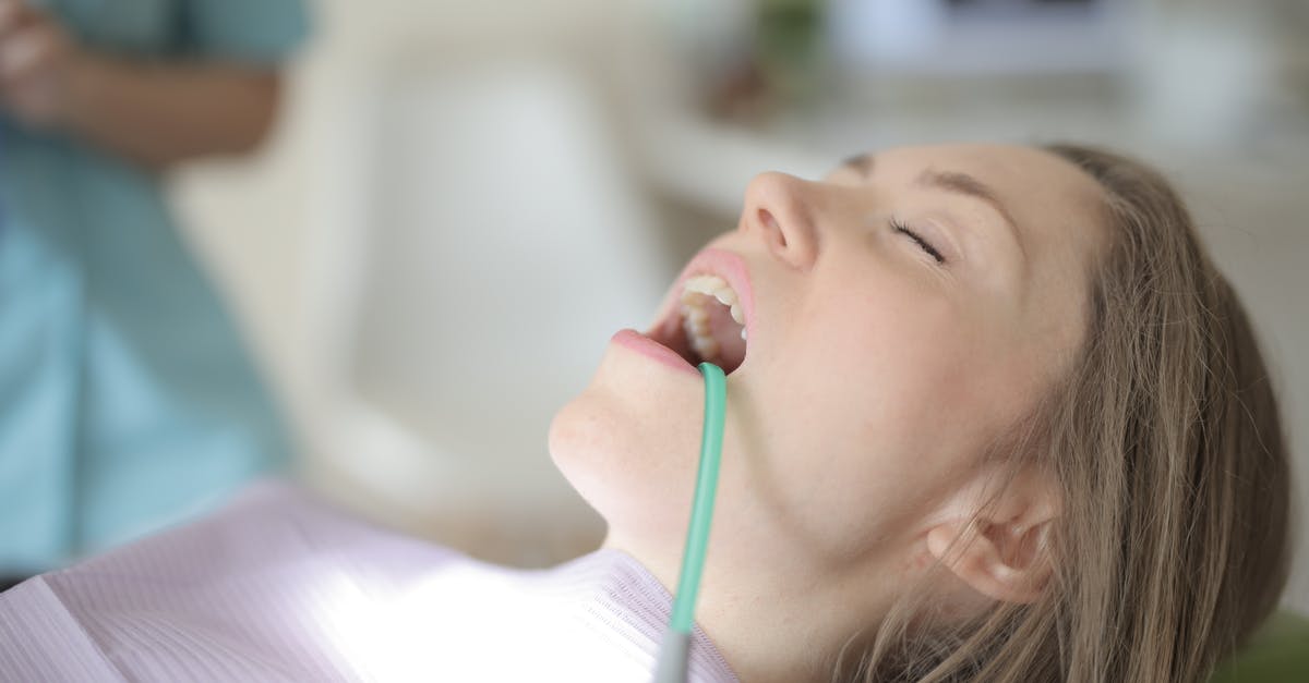 standard visit visa [closed] - Young female patient healing teeth in modern clinic