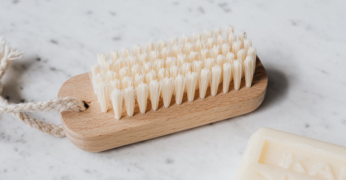 Stay close to nature with daily access to Zurich - Cleaning brush and soap on marble table