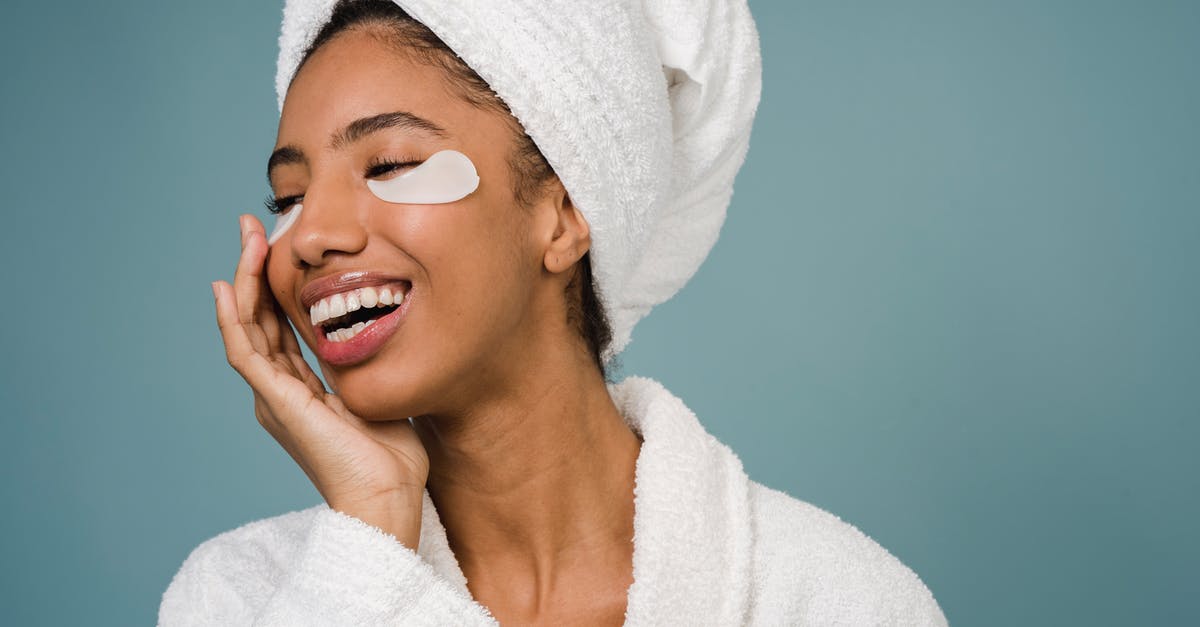 Stay close to nature with daily access to Zurich - Cheerful black female with eye patches against blue background